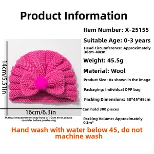 Pink knit baby turban hat with oversized bow detail and soft wool texture for infants