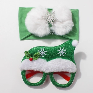 Christmas baby set with green knit headband, white bow, and glittery Santa hat glasses