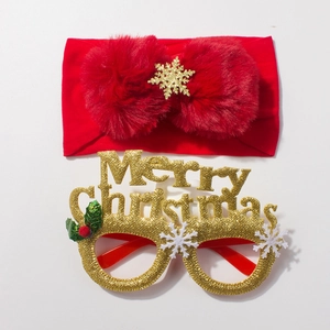 Detail of red bow headband with snowflake and gold Merry Christmas glitter glasses