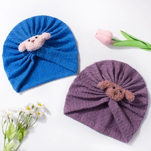 Baby waffle knit beanies in blue and purple with cute plush puppy 3D accessories