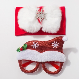 Detail view of red Christmas baby headband with pom pom and glitter santa hat glasses frame