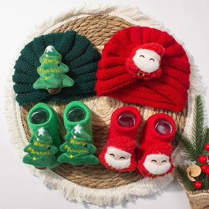 Christmas baby set with festive knit hats and matching socks featuring Santa and tree