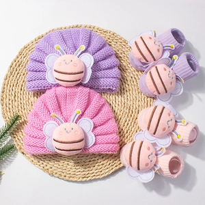 Knitted baby hat and socks set with 3D plush bee design in pink and purple colors