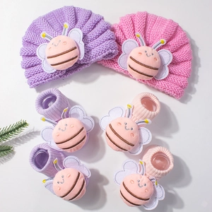 Knitted baby hat and socks set with 3D plush bee decoration in purple and pink