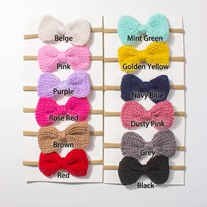 Set of twelve elastic knitted bow headbands for babies in assorted vibrant solid colors