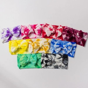 Set of 8 tie-dye nylon headbands for babies featuring large colorful bow decorations