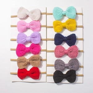 12-piece set of baby knitted bow headbands in assorted colors with elastic nylon bands