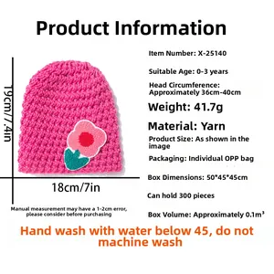 Detailed knit texture of pink crochet baby hat with hand-woven flower decoration