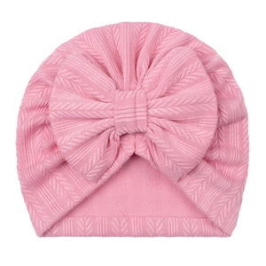 Bonnet turban rose en tricot jacquard pour bébé avec grand nœud et tissu extensible
