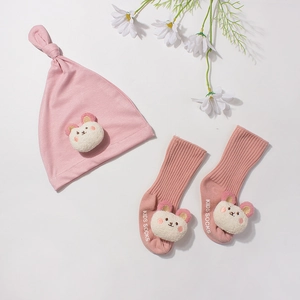 Pink modal baby beanie and socks set with cute bear applique and ribbed knit texture