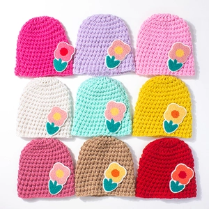 Crochet knit baby beanie hats with floral decor in nine assorted colors for winter warmth