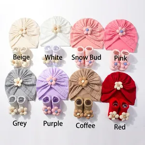 Detailed grid of 8 colors baby floral beanie hat and matching soft sock sets