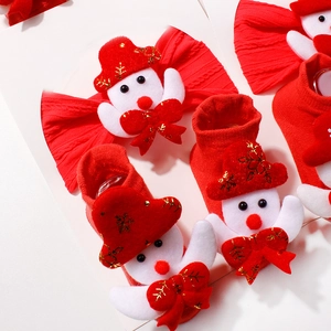 Christmas baby headband and socks set with plush snowman and festive red bow detail