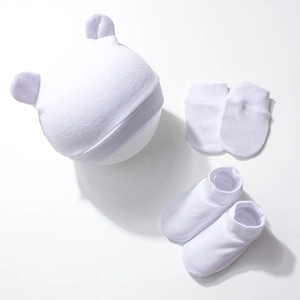 Detailed view of white knitted baby hat with bear ears, anti-scratch mittens and socks set