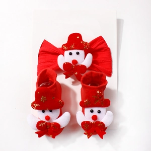 Detail of Christmas baby set with red knit headband, socks and embroidered snowman dolls