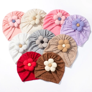 Soft ribbed knit baby hats featuring 3D fabric flowers in various pastel colors