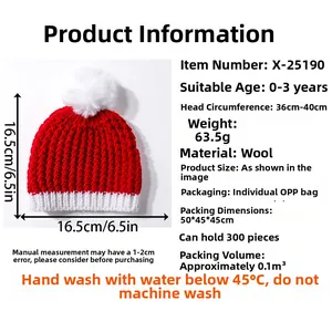 Detailed knit texture of red and white baby Christmas hat with soft white pompom topper