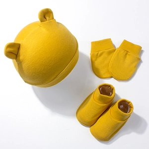 Three-piece baby set in ginger cotton including hat with ears, mittens, and soft booties