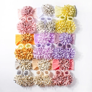 Baby headband and sock set with large spotted floral accents in nine various colors