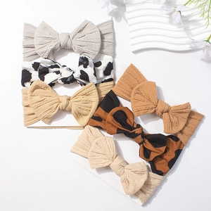 Lot de 6 bandeaux bébé élastiques avec grands nœuds en couleurs unies et motifs