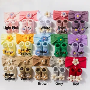 Detailed grid view of 15-color sets featuring baby floral headbands and matching knit socks