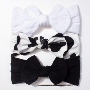 Lot de 3 bandeaux pour bébé avec grands nœuds en blanc, noir et motifs de vache