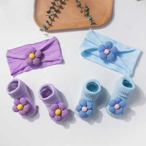 Baby headband and sock set with 3D floral accents in purple and light blue tones