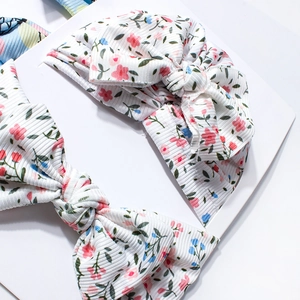 Ensemble de deux bandeaux pour bébé à fleurs avec grands nœuds et tissu côtelé extensible
