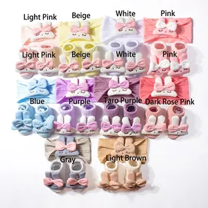 Detail of baby headband and sock set with cute rabbit bow accents in ten soft colors