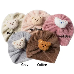 Plush baby earflap hats with cute bear patches in beige, pink, grey, and coffee colors