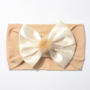 Bandeau élastique pour bébé en nylon avec grand nœud en satin et pompon doux