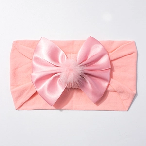 Bandeau élastique rose pour bébé en nylon avec nœud en satin et petit pompon en peluche