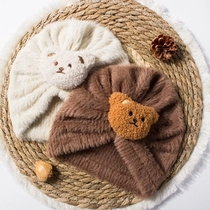 Plush baby hats with bear patch and twisted design in cream and brown for winter