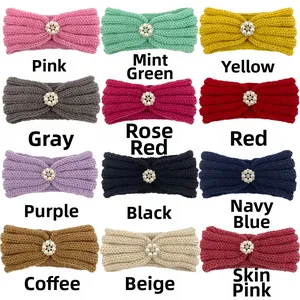 Detail showing twelve colors of soft knitted baby headbands with pearl flower accents