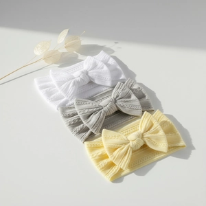 Lot de 3 bandeaux bébé en nylon côtelé souple avec grands nœuds blanc, gris et jaune