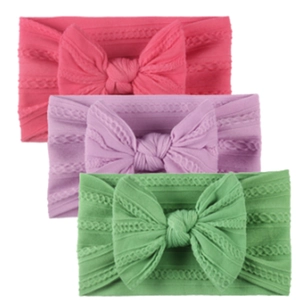 Lot de trois bandeaux bébé en nylon avec grands nœuds en rose, violet et vert pastel