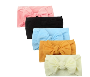 Lot de 5 bandeaux bébé en nylon souple avec grands nœuds en diverses couleurs unies
