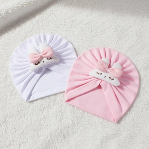 Set of warm knit baby turban hats with cute bunny ears in white and pink soft colors