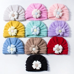 Knitted baby beanie set with decorative fabric flowers in ten assorted pastel colors