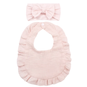 Pale pink cotton muslin baby bib with ruffles and matching large bow headband set