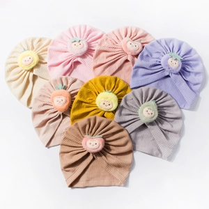 Set of waffle knit baby hats in 8 colors with cute plush fruit smiley face icons