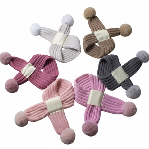 Radial layout showing six colors of baby knitted scarves with fluffy pom poms