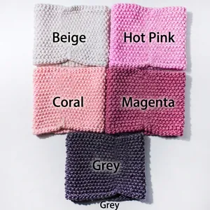 Detail view of honeycomb knit texture in beige pink and grey winter baby scarves
