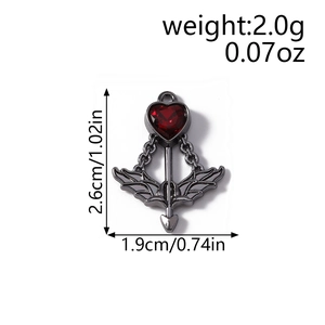 Detailed view of dark gothic heart pendant with red zircon and arrow dimensions