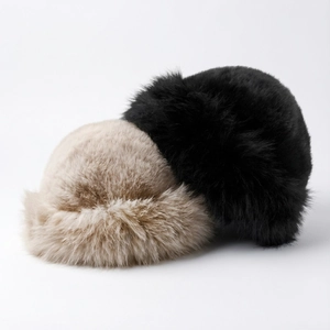 Detail of plush faux mink fur texture on winter mongolian hats in beige and black