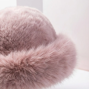 Close-up of soft purple faux fur texture on a warm winter Mongolian bucket hat