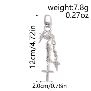 Detail view of rhinestone cross keychain showing dimensions and religious beaded charms