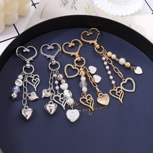 Porte-clés cœur élégant avec perles et strass pour décoration de sac à main chic