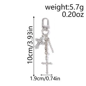 Detailed view of silver cross keychain with rhinestones and bead chain, showing 10cm size