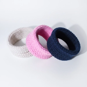 Three-piece set of knit baby neck warmers in cream, pink, and navy blue wool
